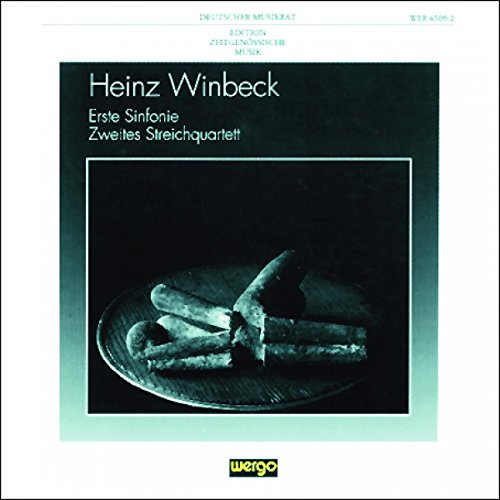 CD cover with dark, abstract image of broken bread and text.
