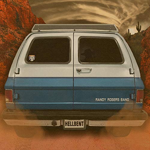 Blue and white van with "Hellbent" license plate, desert background.
