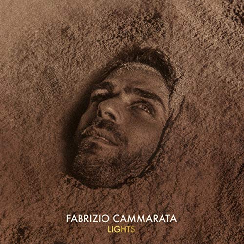 CD cover: a man’s face sketched in sand, with the title “Lights”.