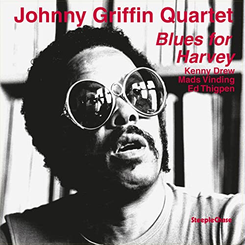 Record album cover featuring Johnny Griffin with sunglasses, red background.