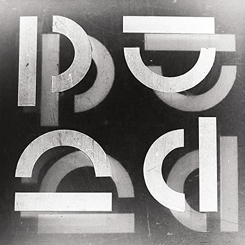 Black and white vinyl cover featuring abstract geometric shapes resembling letters or symbols.
