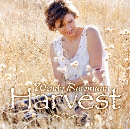 CD cover for Wendy Bawmann’s “Harvest” featuring a woman in a field.
