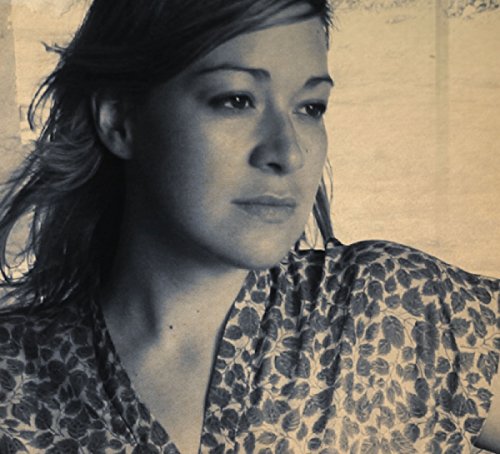Close-up portrait of Jill Barber, a woman with long brown hair.