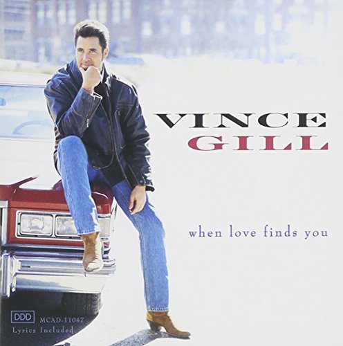 Vince Gill album cover, featuring him leaning on a classic red car.