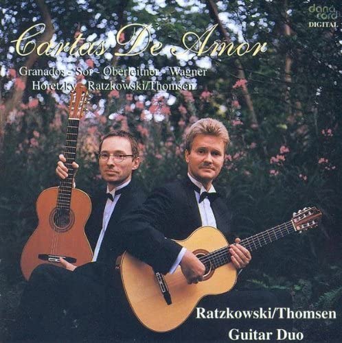 CD cover: two men with guitars, “Cartas De Amor” title art.