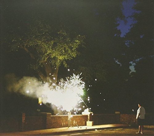 CD cover with a nighttime image of fireworks and a silhouetted figure.