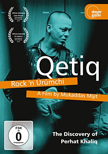 DVD cover for "Qetiq," featuring a man playing guitar.