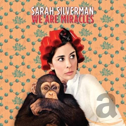 Sarah Silverman album cover with red hair rollers and a monkey.