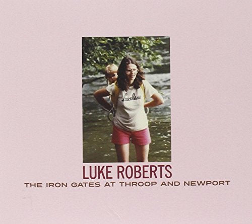 CD cover featuring a vintage photo of two people by a river.