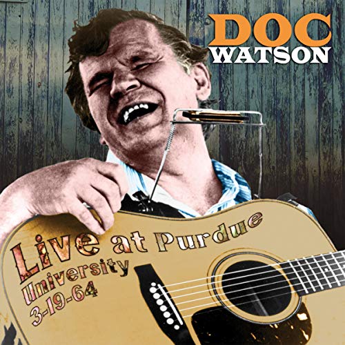 Doc Watson smiling with guitar, album cover for “Live At Purdue University.”