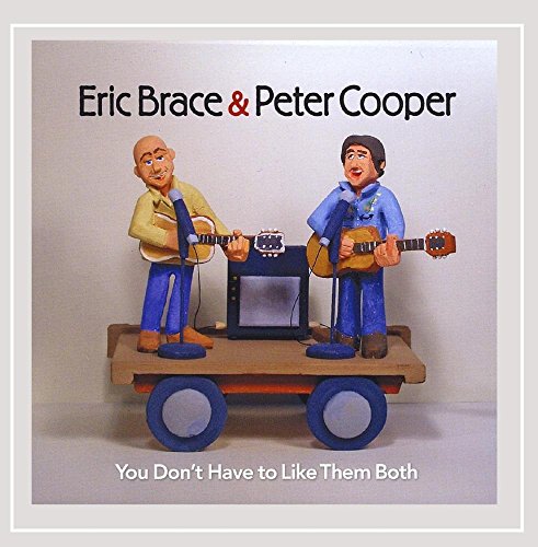 CD cover featuring two cartoon musicians with guitars on a stage.