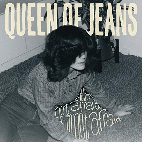Album cover for Queen of Jeans featuring a woman in a plaid shirt.