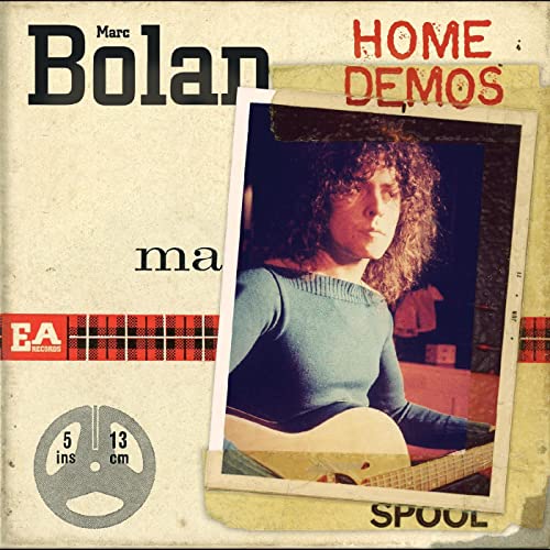 Album cover featuring Marc Bolan playing guitar, overlaid with a vintage tape spool graphic.