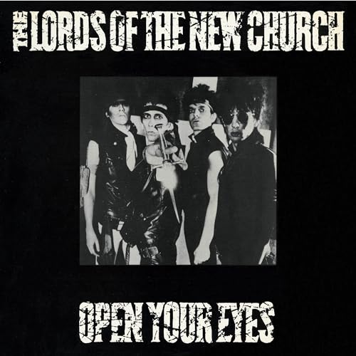 Black and white album cover featuring four figures in dark clothing.
