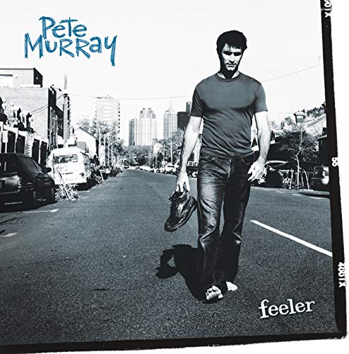 CD cover for Pete Murray’s “Feeler” featuring a man walking on a street.