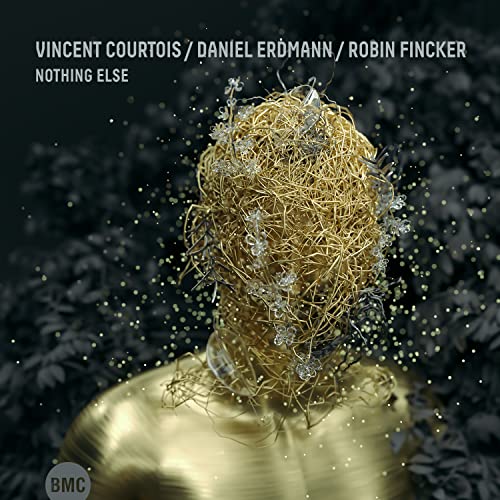 CD cover: golden, abstract head dissolving into sparkling particles.