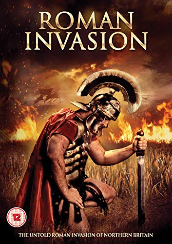 Roman soldier kneeling in a burning field, wearing armor and a helmet.