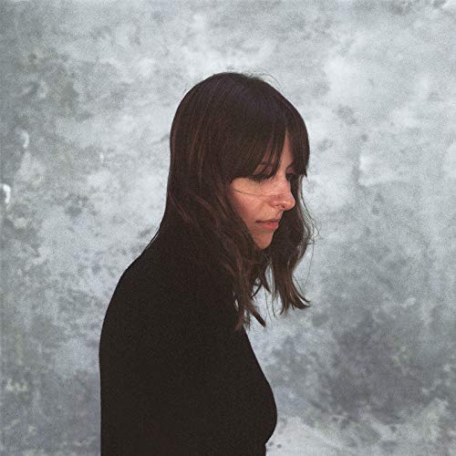 Molly Burch album cover: woman with dark hair, looking downward.
