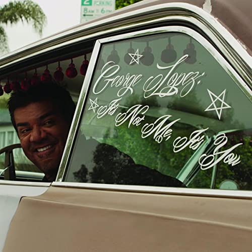 George Lopez comedy album cover featuring him smiling from a car window.