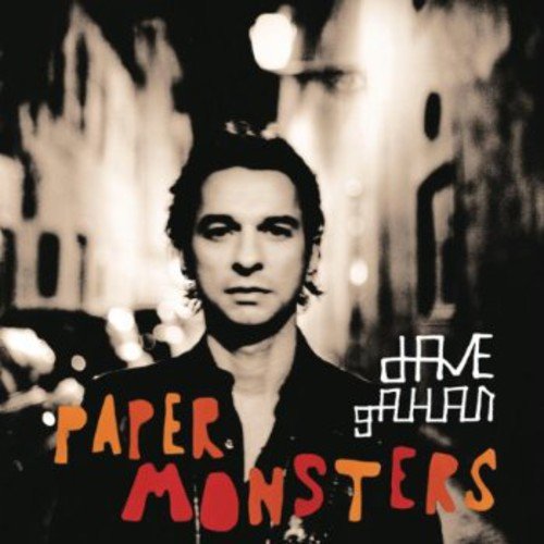 Dave Gahan portrait with blurred city background and album title.