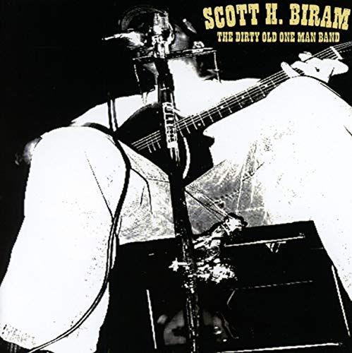High-contrast black and white image of Scott H. Biram playing guitar and singing.