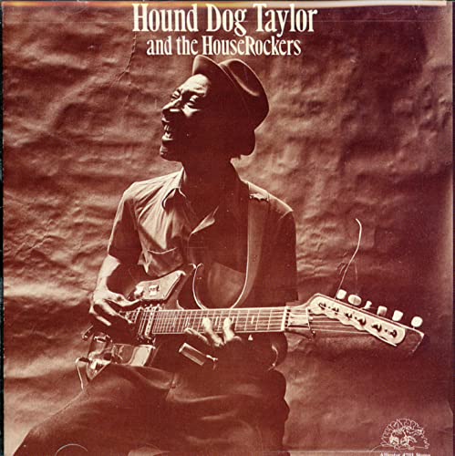 Hound Dog Taylor playing guitar, album cover in sepia tones.