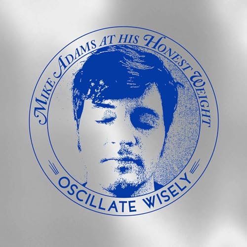 Circular album cover featuring a halftone portrait of Mike Adams.