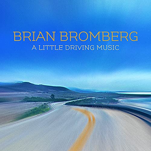 CD cover: blue sky, winding road, and album title “A Little Driving Music”.