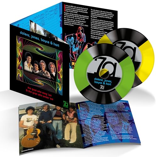 CD album set featuring a gatefold cover, booklet, and two colored vinyl records.