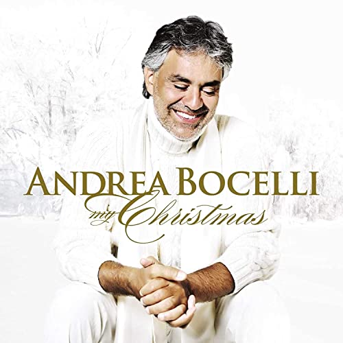 Andrea Bocelli album cover, snowy background, smiling man in white sweater.