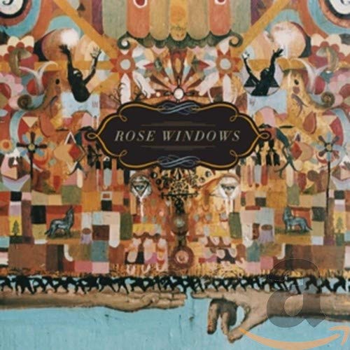 CD cover art: ornate, colorful illustration with figures and hands.