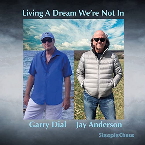 CD cover featuring two men in sunglasses by the ocean.