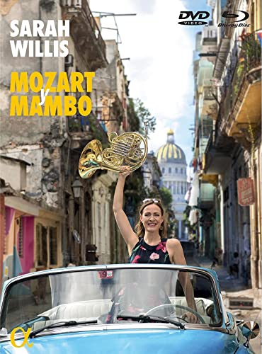 Sarah Willis holds a French horn in front of a Cuban street scene.