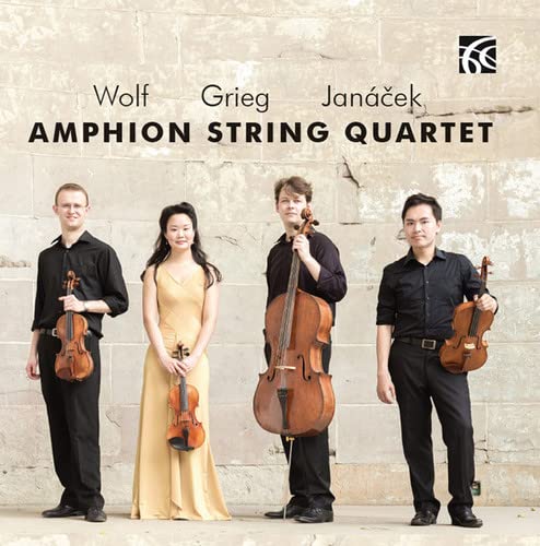 Amphion String Quartet members with violins and a cello, against a stone wall.