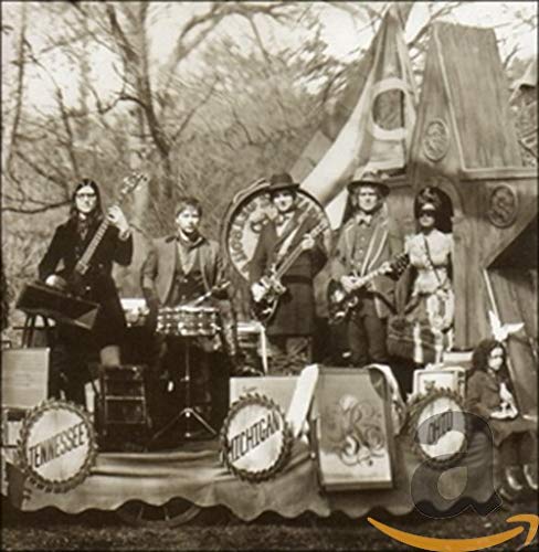 Sepia-toned photo of The Raconteurs band performing on a decorated float.