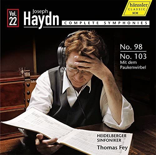 CD cover: man with sheet music and headphones, Haydn symphonies volume 22.