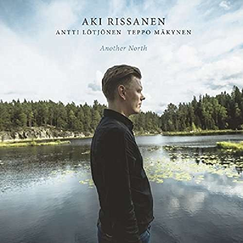 CD cover featuring a man’s profile against a lake and forest backdrop.