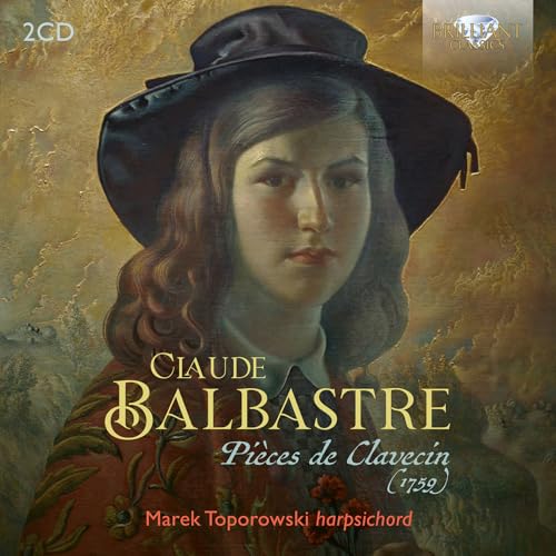 CD cover: portrait of a man in a hat, golden background.