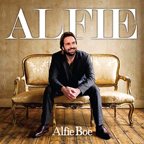 Alfie Boe album cover featuring the singer seated on a vintage couch.