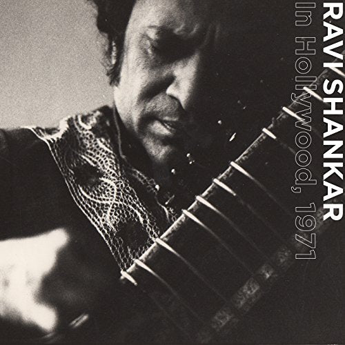 Black and white portrait of Ravi Shankar playing a sitar, album cover.