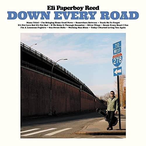CD cover: Eli Paperboy Reed stands with a guitar near a highway.