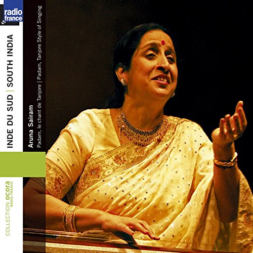 Aruna Sairam, a South Indian singer in a gold sari, performing.