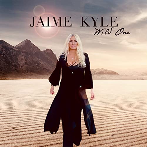 Album cover for Jaime Kyle’s “Wild One” featuring a woman in a desert landscape.