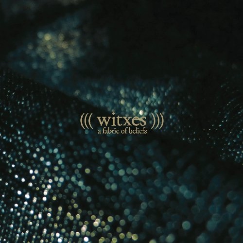 Dark blue album cover with sparkling texture and white text: "Witxes - A Fabric Of Beliefs".
