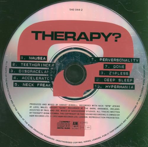 CD with red and white label displaying the band name "Therapy?" and tracklist.