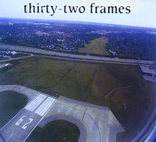CD cover: aerial view of an airport runway and surrounding landscape.