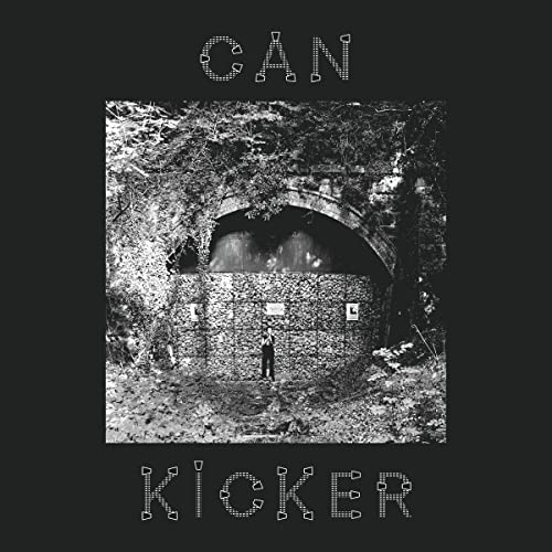 Black and white album cover featuring a person in front of a tunnel.