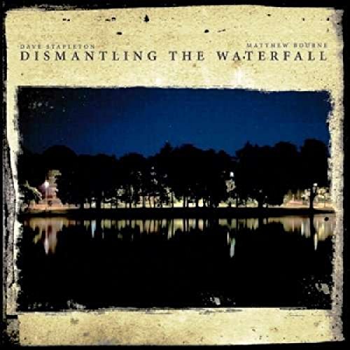 CD cover with a dark, reflective landscape and text at the top.