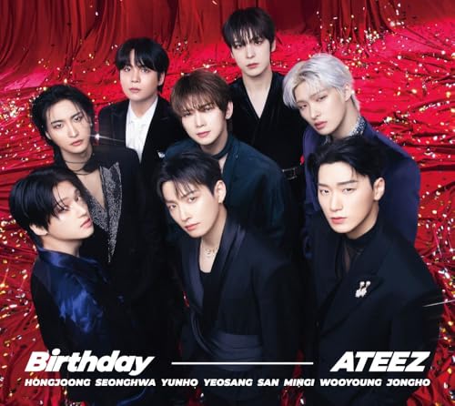 Ateez members in dark suits pose against a shimmering red background.