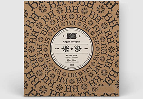 Vinyl record cover with floral pattern and central label featuring an organ.